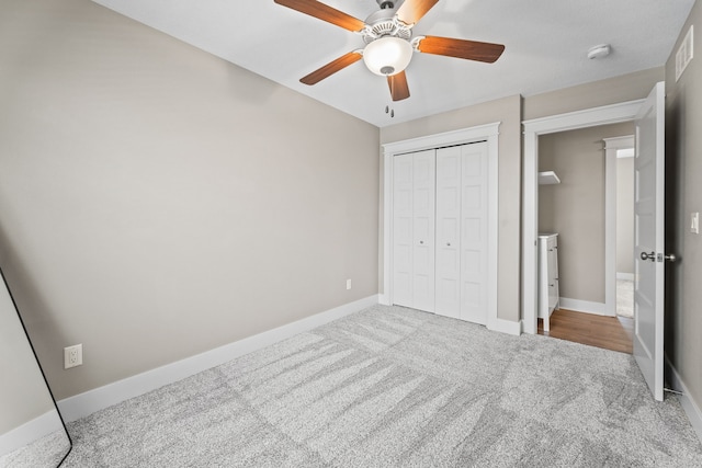 bedroom featuring a closet, ceiling fan, and carpet