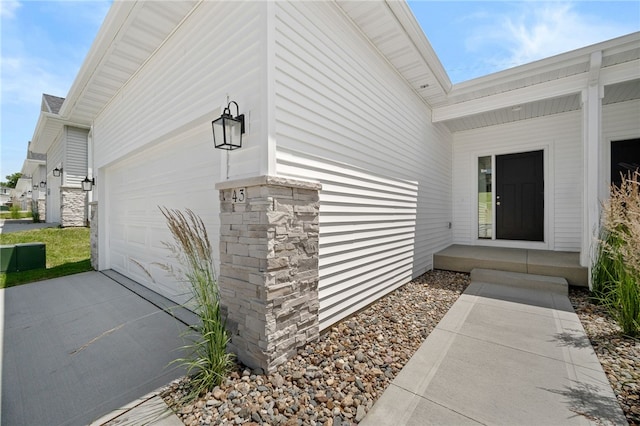 doorway to property featuring a garage