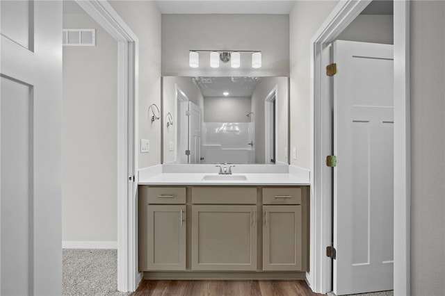 bathroom featuring vanity and walk in shower