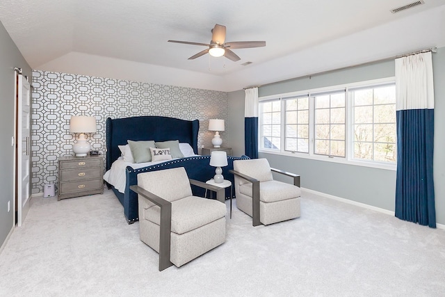 bedroom with lofted ceiling, light colored carpet, and ceiling fan