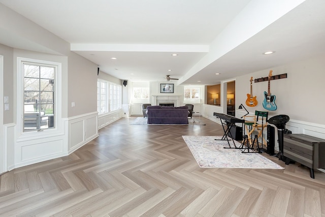 interior space with ceiling fan and light parquet flooring