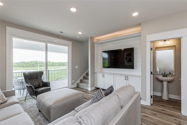 living room with light hardwood / wood-style floors