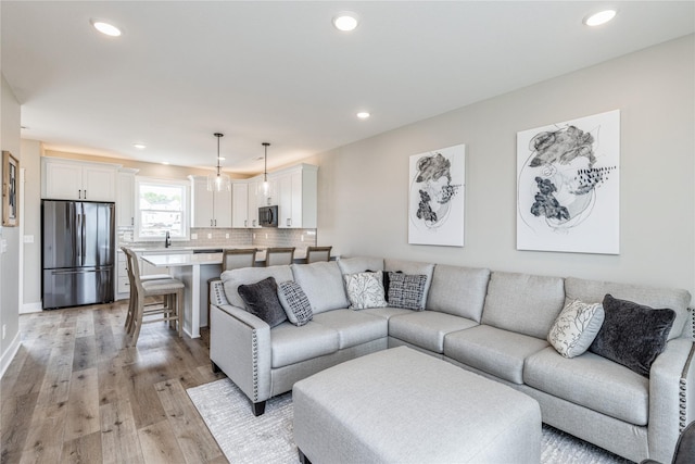 living room with light hardwood / wood-style floors