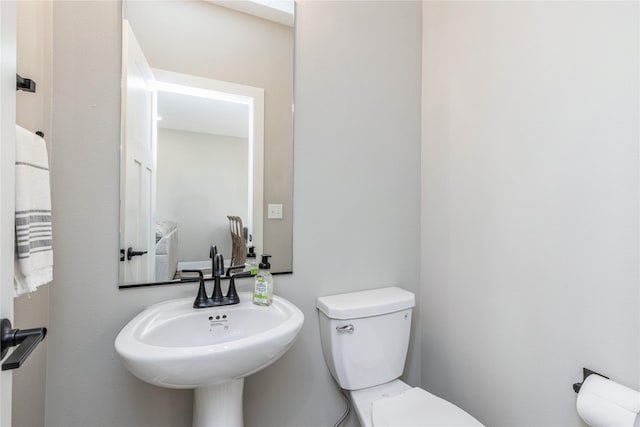 bathroom with sink and toilet