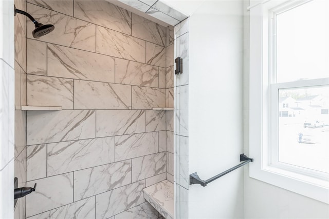 bathroom with tiled shower