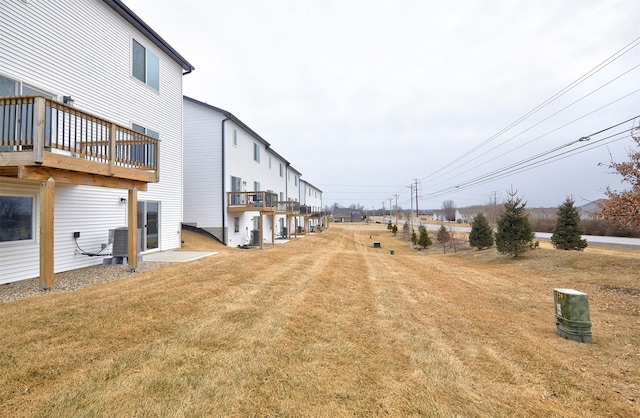 view of yard with central air condition unit