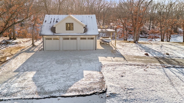 view of snow covered garage