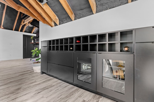 details with beamed ceiling and hardwood / wood-style flooring