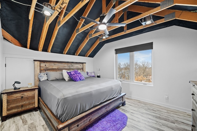 bedroom featuring wood-type flooring, lofted ceiling, and ceiling fan