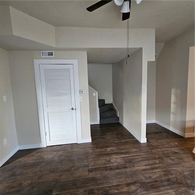 empty room featuring dark hardwood / wood-style floors and ceiling fan