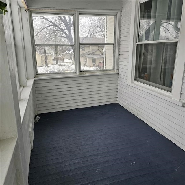 unfurnished sunroom featuring a healthy amount of sunlight