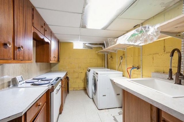 laundry area with washer and dryer and sink