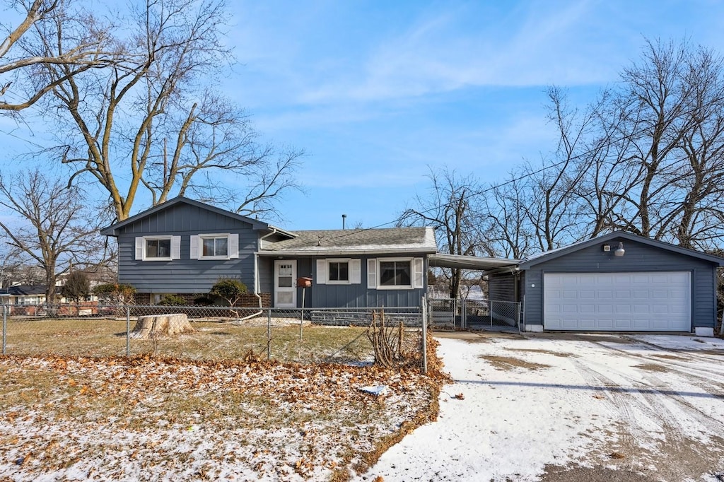 view of front of home featuring a carport and a garage