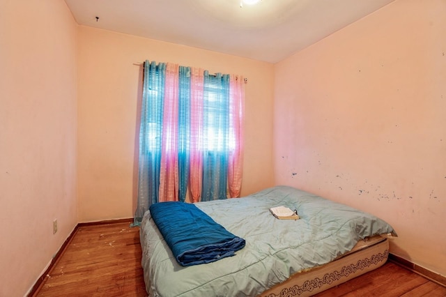 bedroom featuring wood-type flooring