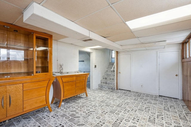 interior space featuring a paneled ceiling