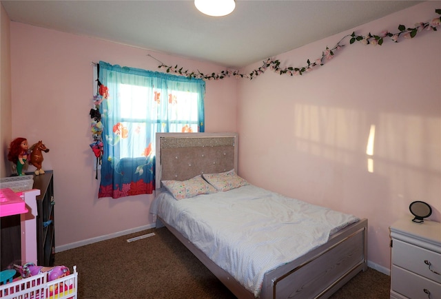 bedroom featuring dark colored carpet