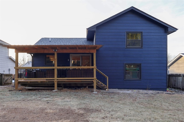 back of house featuring a deck