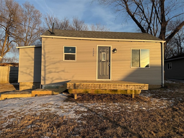 view of front facade with a wooden deck