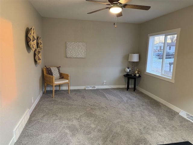 unfurnished room with ceiling fan and carpet flooring