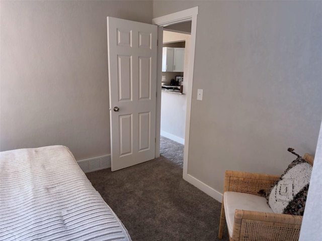 bedroom with carpet, visible vents, and baseboards