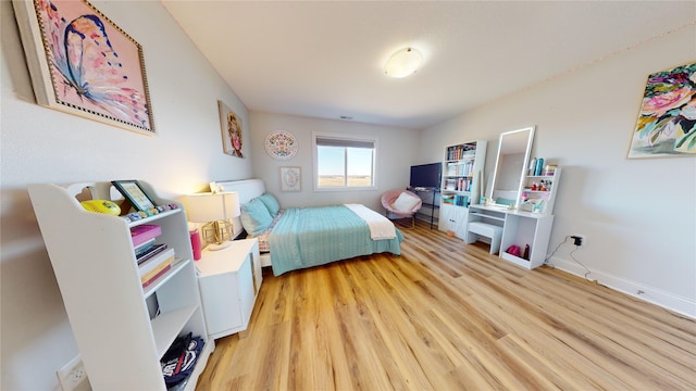 bedroom with light hardwood / wood-style flooring