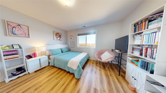 bedroom featuring light wood-type flooring