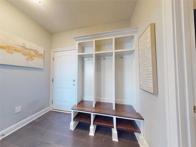 mudroom with a textured ceiling