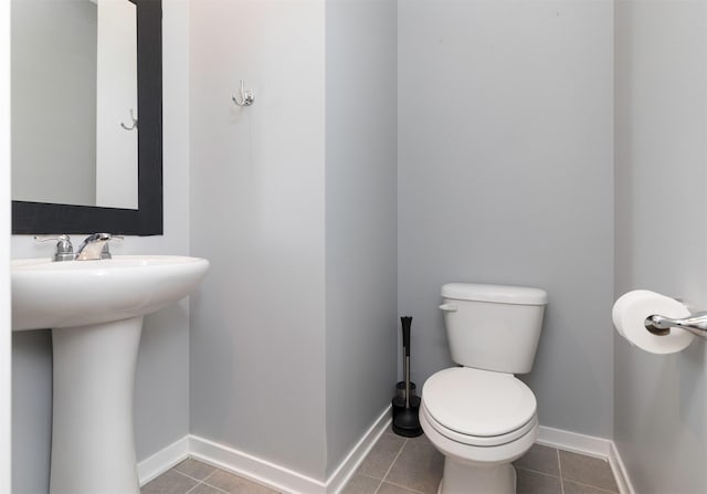 bathroom featuring tile patterned floors and toilet