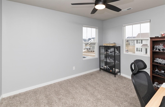 office featuring carpet and ceiling fan