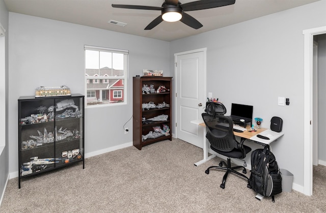 office featuring light carpet and ceiling fan