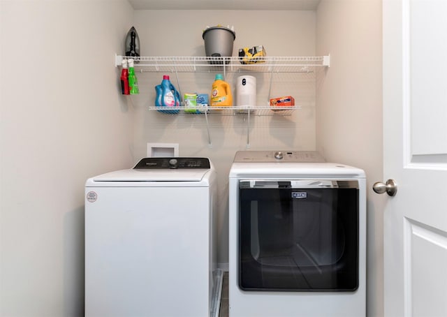 washroom featuring washing machine and dryer