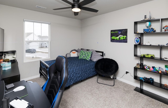 bedroom with light carpet and ceiling fan