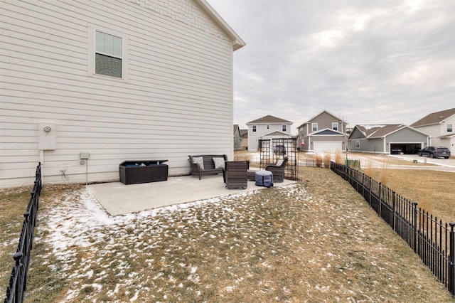 view of side of home featuring a patio area