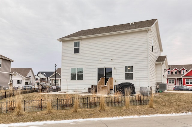 rear view of property featuring cooling unit