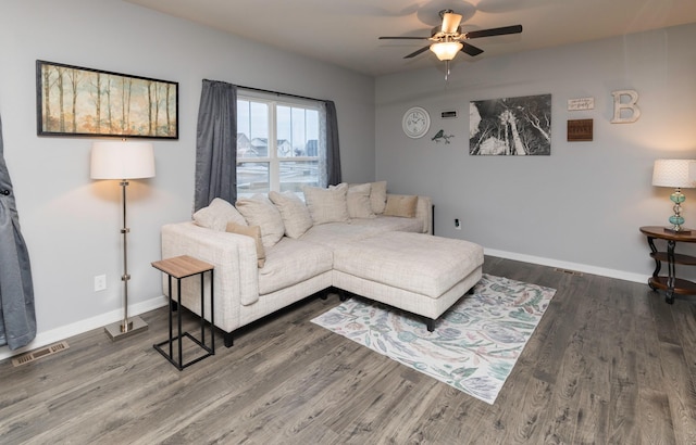 living room with hardwood / wood-style flooring and ceiling fan