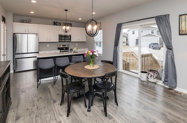 dining area with hardwood / wood-style flooring