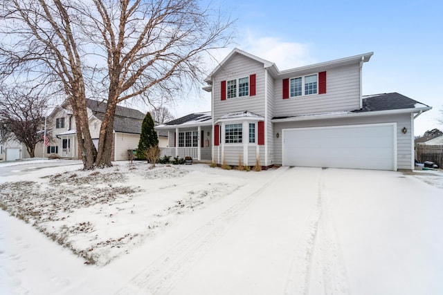 view of front property with a porch and a garage