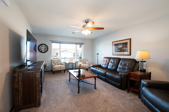 living room featuring carpet and ceiling fan