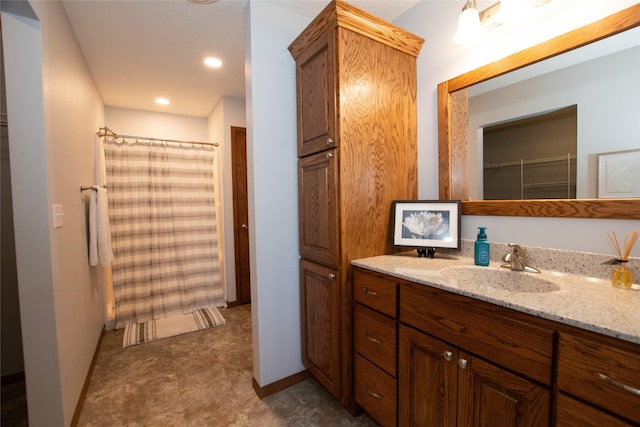 bathroom with vanity and curtained shower