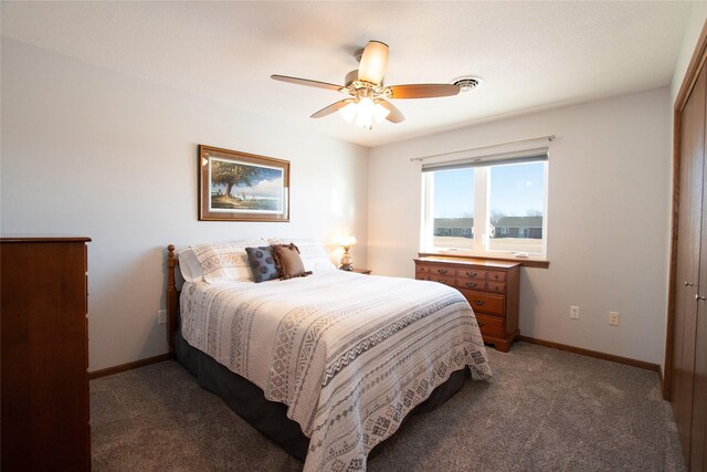 carpeted bedroom with ceiling fan and a closet