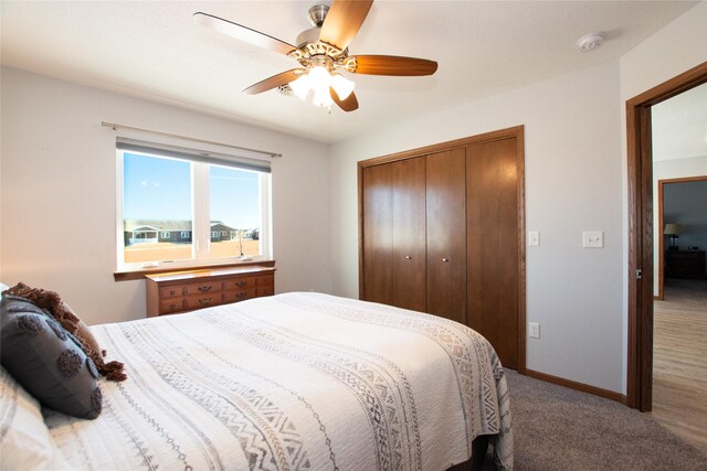 bedroom featuring a closet, ceiling fan, and carpet