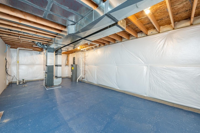 basement with heating unit and electric water heater