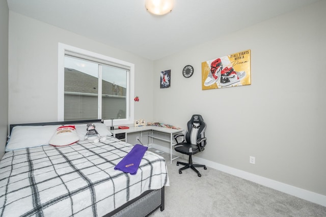 bedroom with light colored carpet