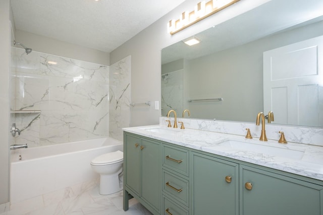 full bathroom with vanity, tiled shower / bath combo, a textured ceiling, and toilet