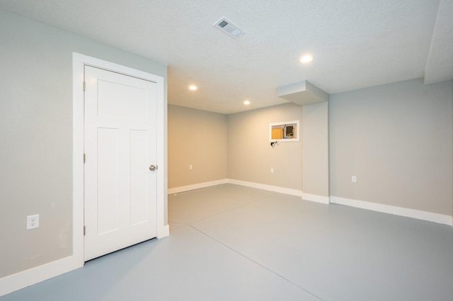 basement with a textured ceiling