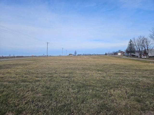 view of yard with a rural view