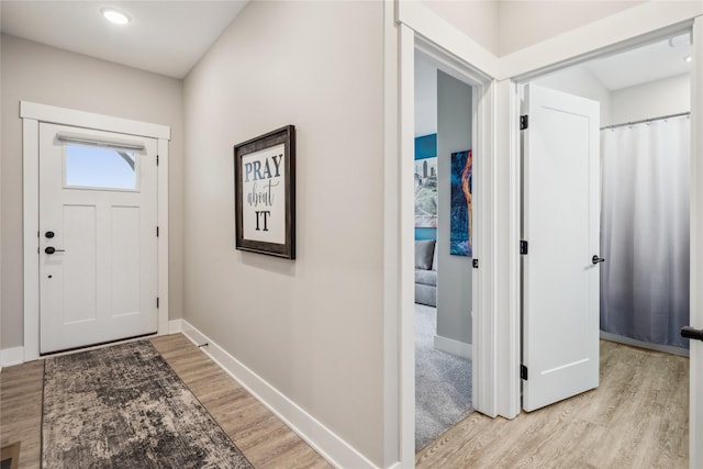 entryway with light hardwood / wood-style flooring