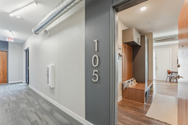 400 SW 7th St Unit 105, Des Moines, IA 50309 - corridor featuring wood finished floors and baseboards