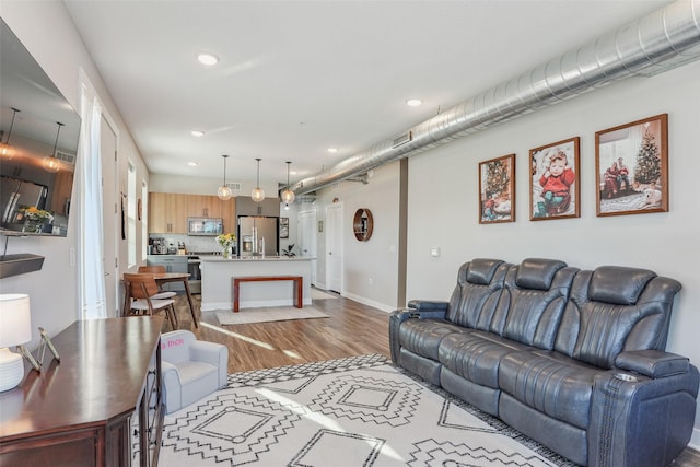 living room with light hardwood / wood-style flooring