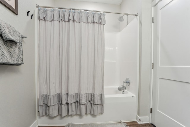 bathroom featuring shower / bathtub combination with curtain